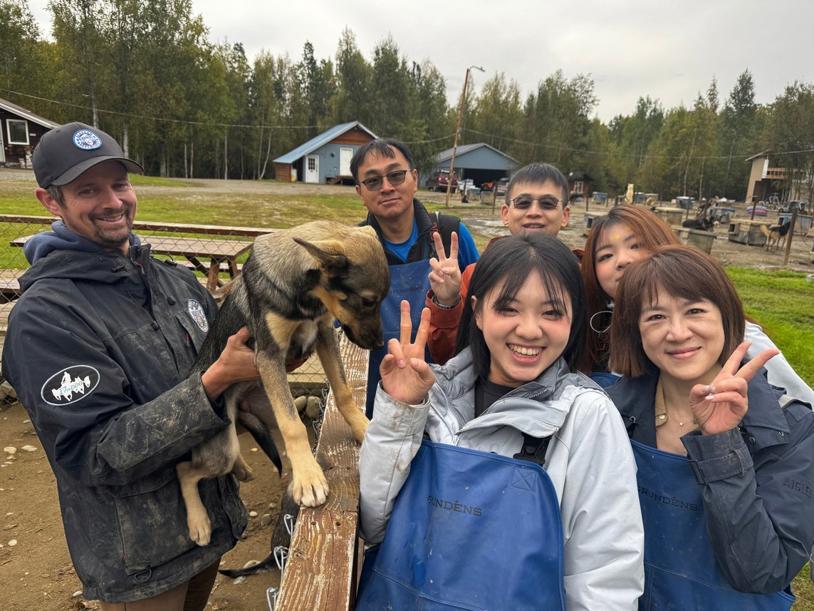 Riley with friends and a sled dog